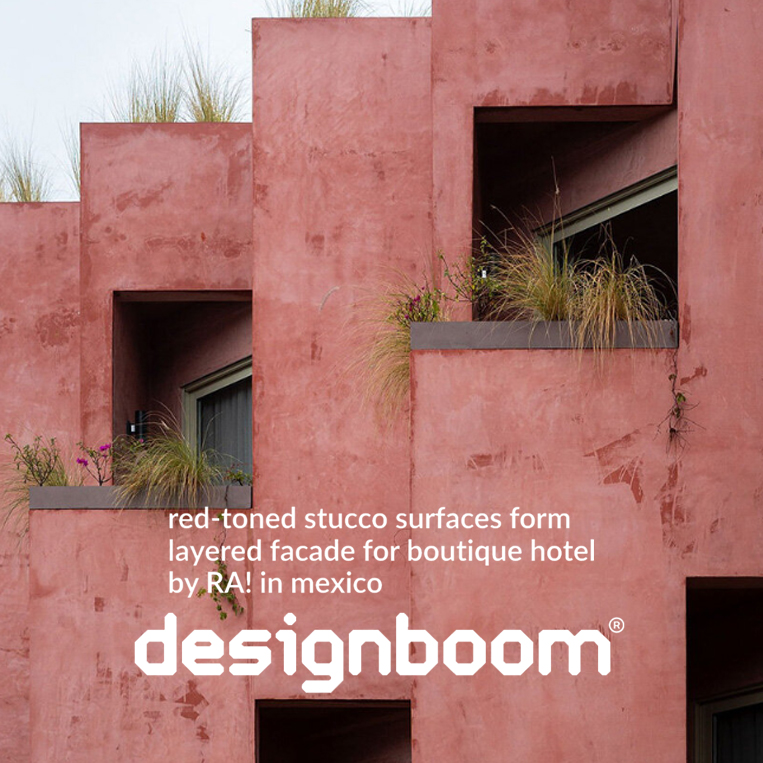 red-toned stucco surfaces form layered facade for boutique hotel by RA! in mexico